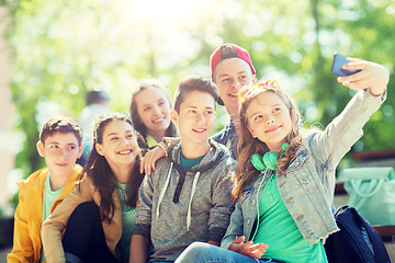 Image showing happy teenage students taking selfie by smartphone