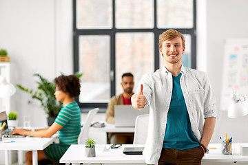 Image showing happy smiling man at office