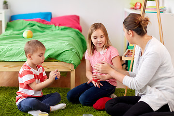 Image showing kids and mother with modelling clay or slimes