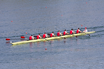Image showing Rowers in eight-oar rowing boats on the tranquil lake