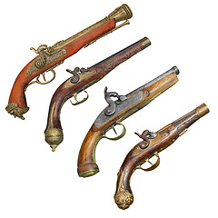 Image showing Four old vintage firelock gun isolated on white background