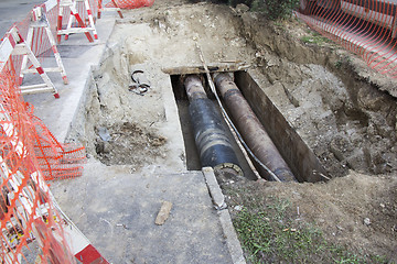 Image showing Repair of heating pipes at a depth of excavated trench
