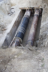 Image showing Repair of heating pipes at a depth of excavated trench