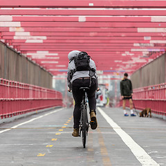 Image showing Man riding his bike in the cycling lane on Williamsburg Bridge, Brooklyn, New York City.