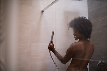 Image showing African American woman in the shower