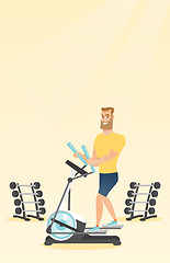 Image showing Man exercising on elliptical trainer.