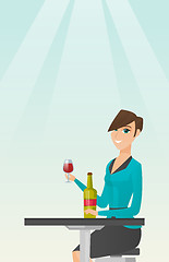 Image showing Woman drinking wine in the restaurant.