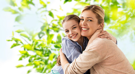 Image showing happy smiling mother hugging daughter