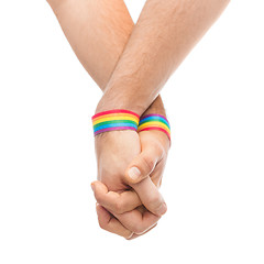 Image showing hands of couple with gay pride rainbow wristbands