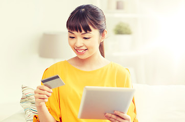 Image showing happy asian woman with tablet pc and credit card