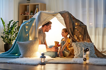 Image showing happy family playing with toy in kids tent at home