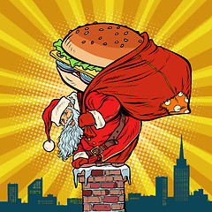 Image showing Santa Claus with a Burger climbs into the chimney. Food delivery
