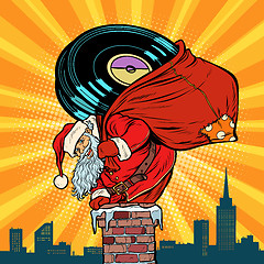 Image showing Santa Claus with vinyl records climbs into the chimney