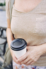 Image showing Crop lady with hot beverage