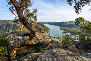 Image showing Woman chillaxing with river views in Australian bushland