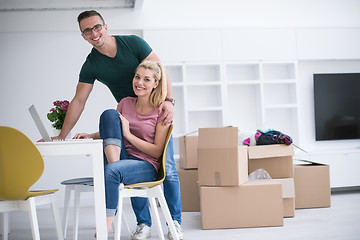 Image showing Young couple moving in a new home