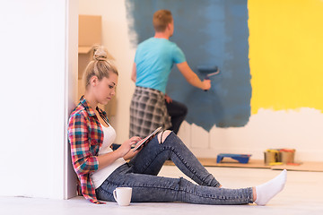 Image showing couple doing home renovations