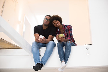 Image showing couple having break during moving to new house