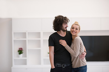 Image showing couple hugging in their new home