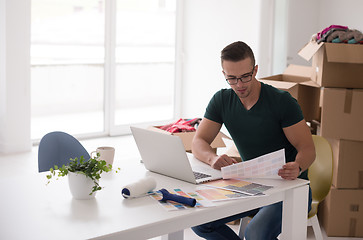 Image showing Young man moving in a new home