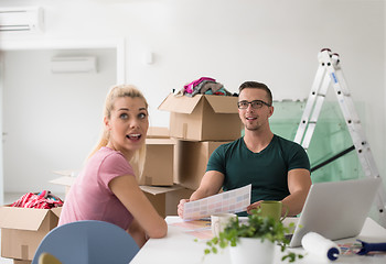 Image showing Young couple moving in a new home