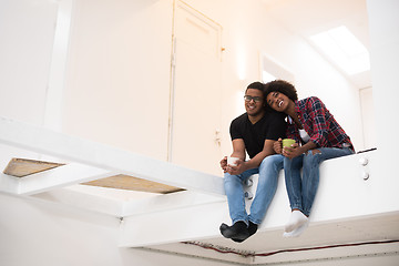 Image showing couple having break during moving to new house