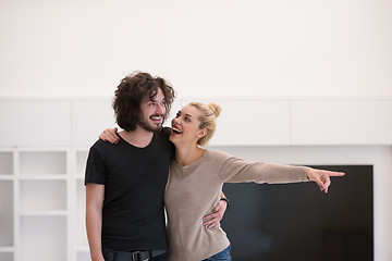 Image showing couple hugging in their new home