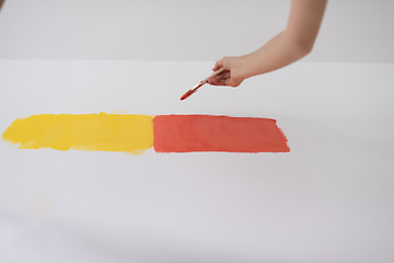 Image showing couple painting interior wall