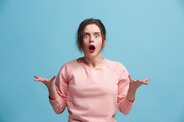 Image showing The young emotional angry and scared woman standing and looking at camera