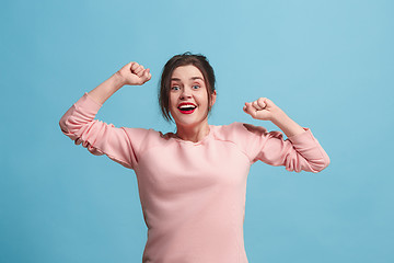 Image showing Winning success woman happy ecstatic celebrating being a winner. Dynamic energetic image of female model