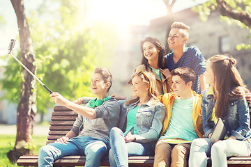 Image showing happy teenage students taking selfie by smartphone