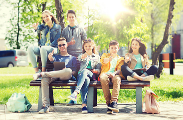 Image showing group of students with tablet pc at school yard