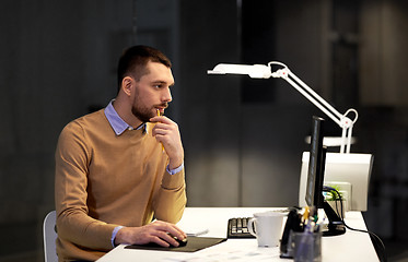 Image showing man with computer working late at night office