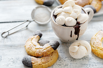 Image showing Cup with hot chocolate and almond cookies.