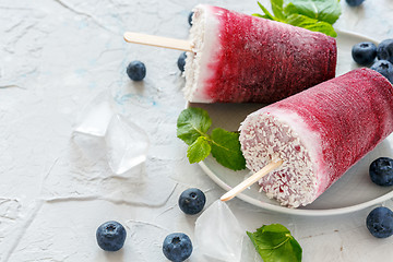 Image showing Plate of vegan berry popsicles with coconut milk.