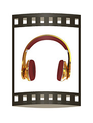 Image showing Golden headphones. 3d illustration. The film strip.