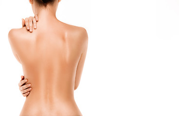 Image showing Naked back of a woman, isolated on white background