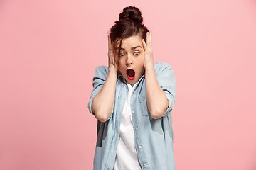 Image showing Beautiful woman looking suprised isolated on pink