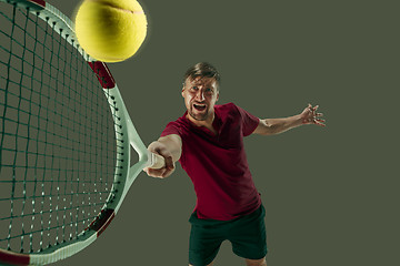 Image showing one caucasian man playing tennis player isolated on white background