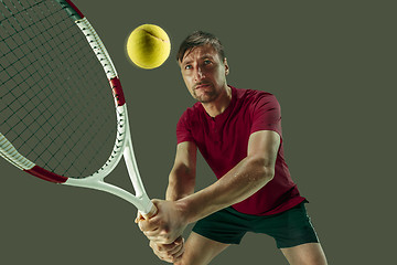 Image showing one caucasian man playing tennis player isolated on white background