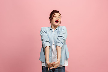 Image showing Beautiful woman looking suprised isolated on pink