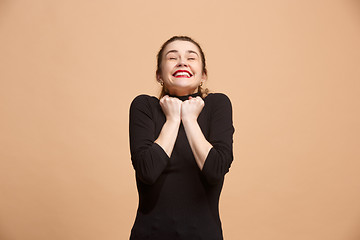 Image showing Winning success woman happy ecstatic celebrating being a winner. Dynamic energetic image of female model