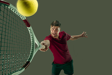 Image showing one caucasian man playing tennis player isolated on white background