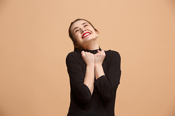 Image showing Winning success woman happy ecstatic celebrating being a winner. Dynamic energetic image of female model