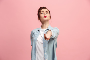 Image showing The overbearing business woman point you and want you, half length closeup portrait on pink background.