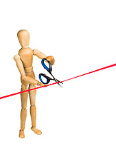 Image showing Wooden mannequin cutting red ribbon 