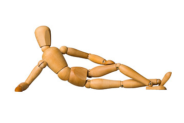 Image showing Wooden mannequin lying down