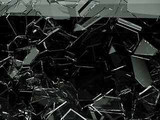 Image showing Pieces of splitted or cracked glass on black