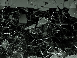 Image showing Pieces of splitted or cracked glass on black