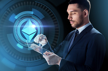 Image showing businessman with tablet pc and ethereum hologram